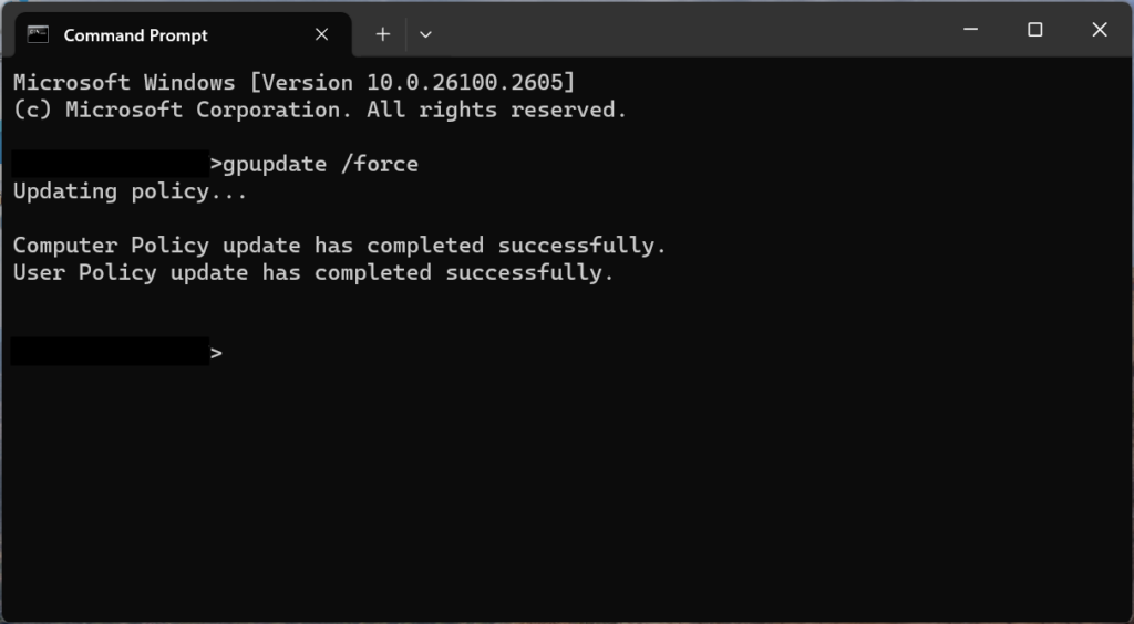 Windows command prompt showing a completed group policy update.